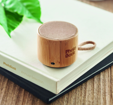 Logotrade advertising products photo of: Round bamboo wireless speaker